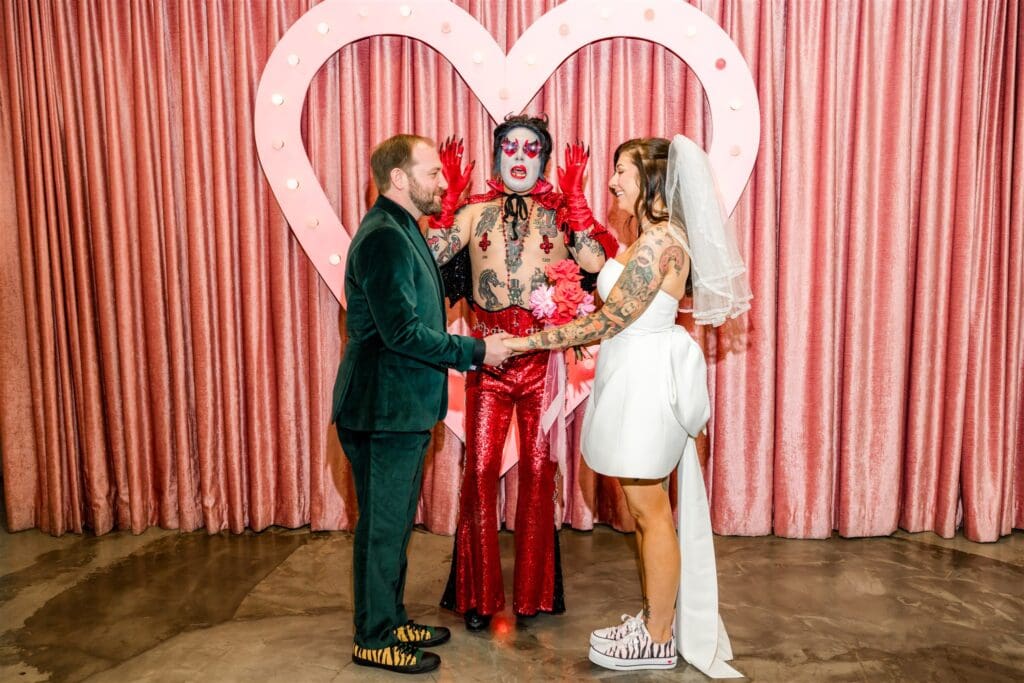 bride and groom holding hands during their wedding ceremony