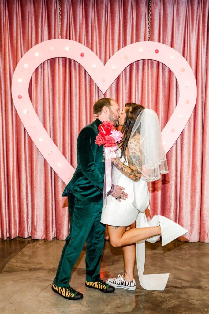 cute picture of the newlyweds kissing after their ceremony