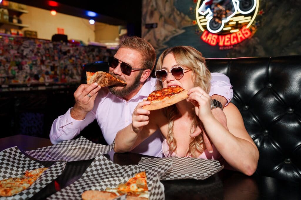 cute picture of the newly engaged couple celebrating with pizza