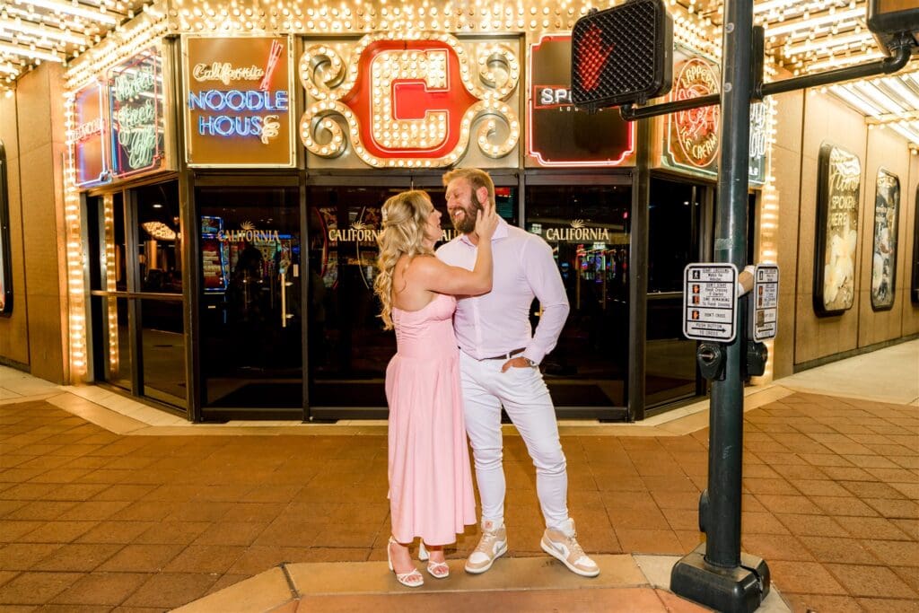 cute picture of the newly engaged couple smiling at each other