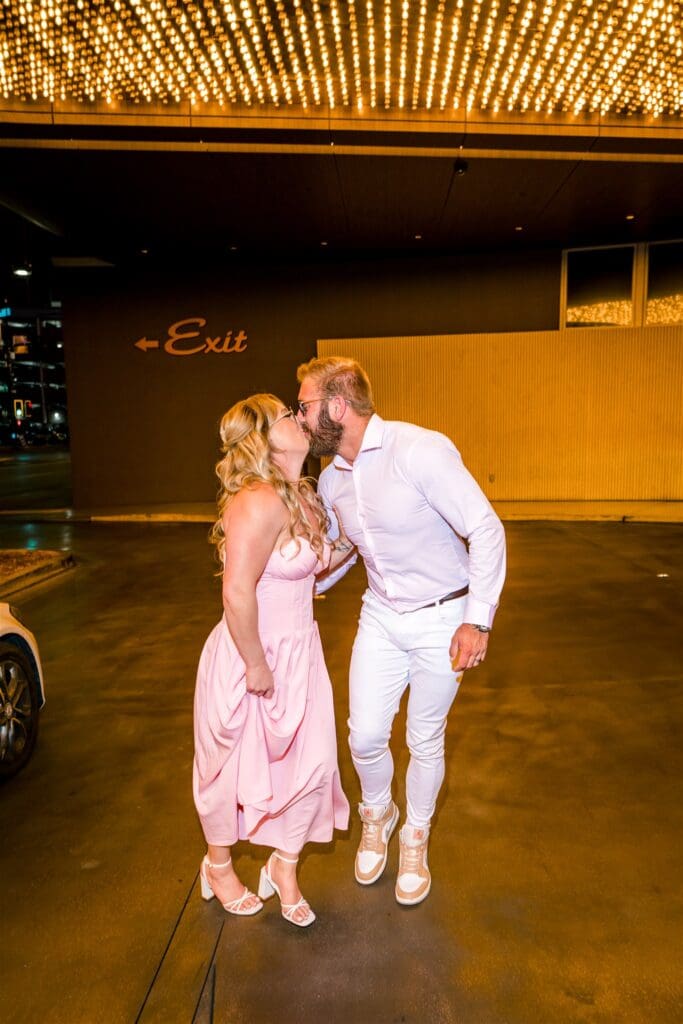 newly engaged couple kissing during their photoshoot