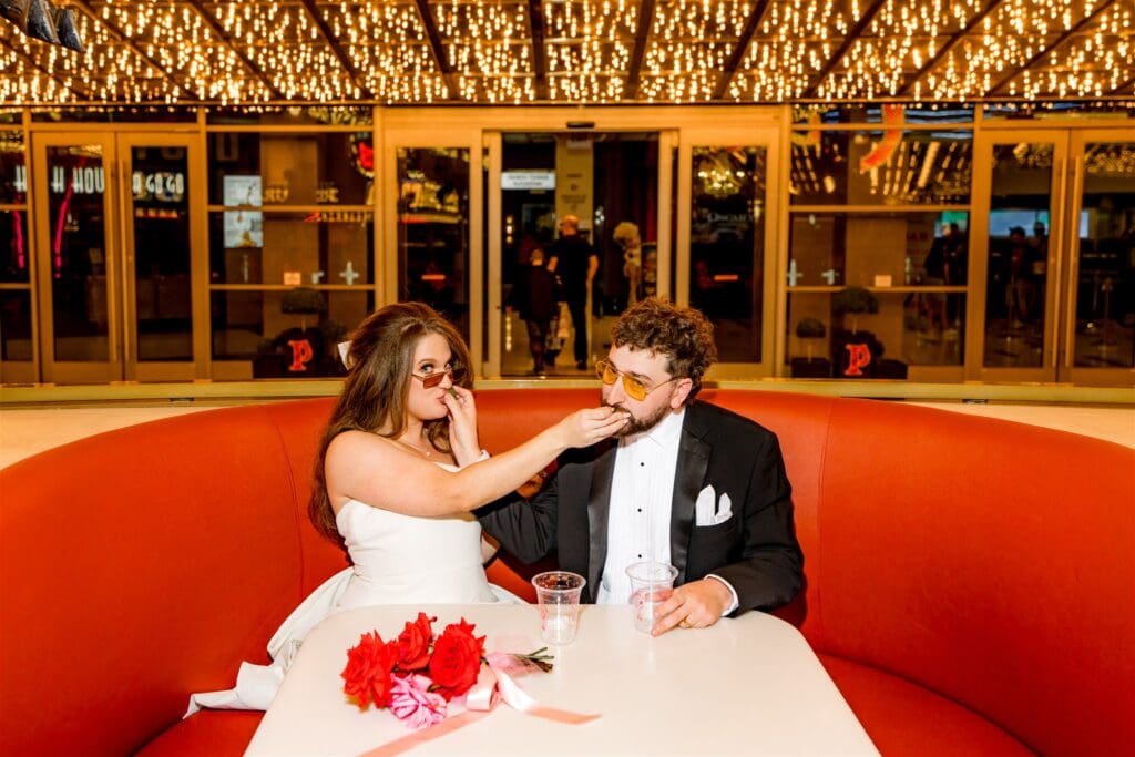 Newly married couple celebrating their developments with cake