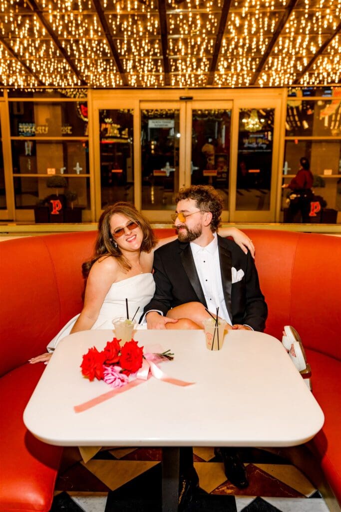 Newly married couple celebrating their development with drinks
