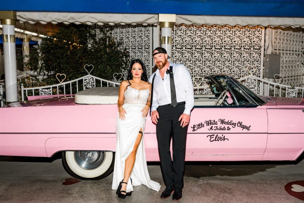 picture of the couple smiling at the camera during their photoshoot