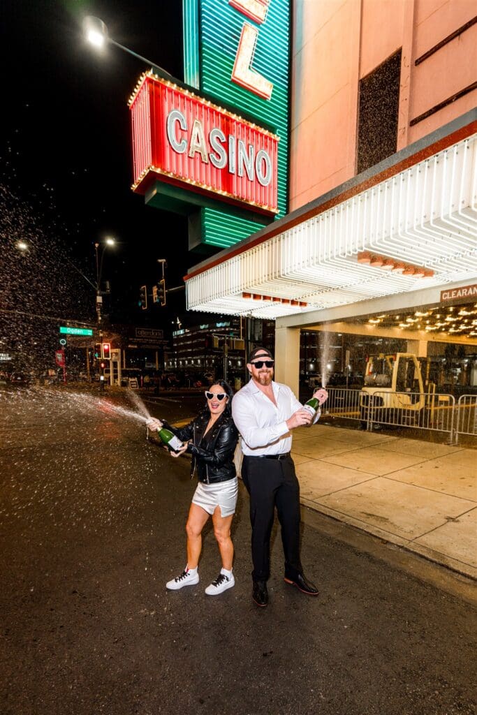 couple celebrating their elopement with champagne