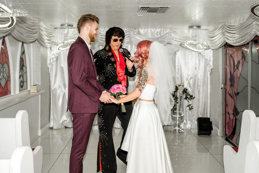 bride and groom holding hands during their ceremony