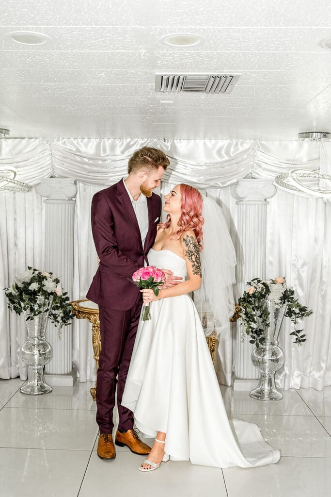 cute picture of the newlyweds smiling at each other