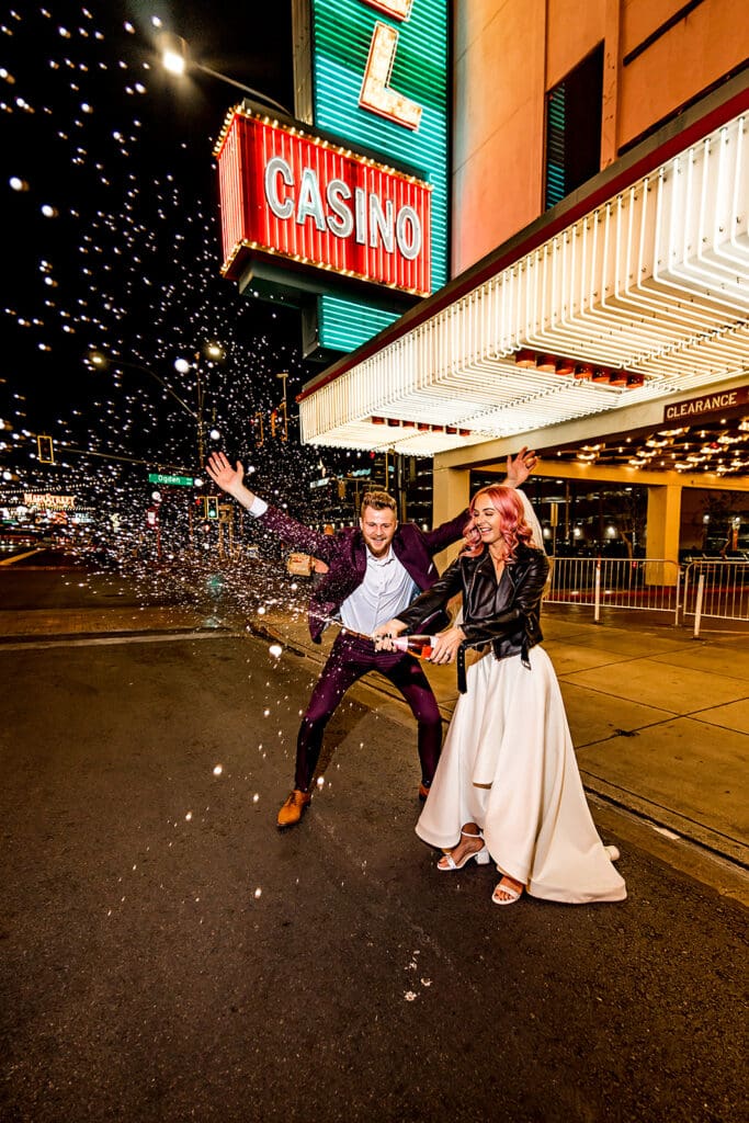 newlyweds celebrating their elopement with champagne