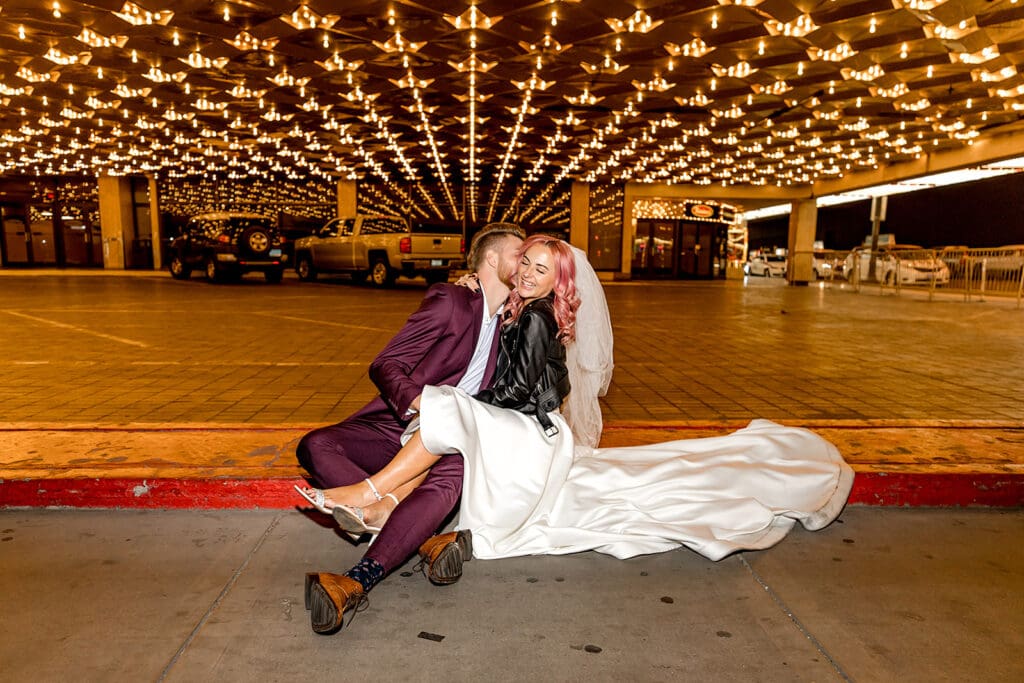 groom kissing the bride on the cheek