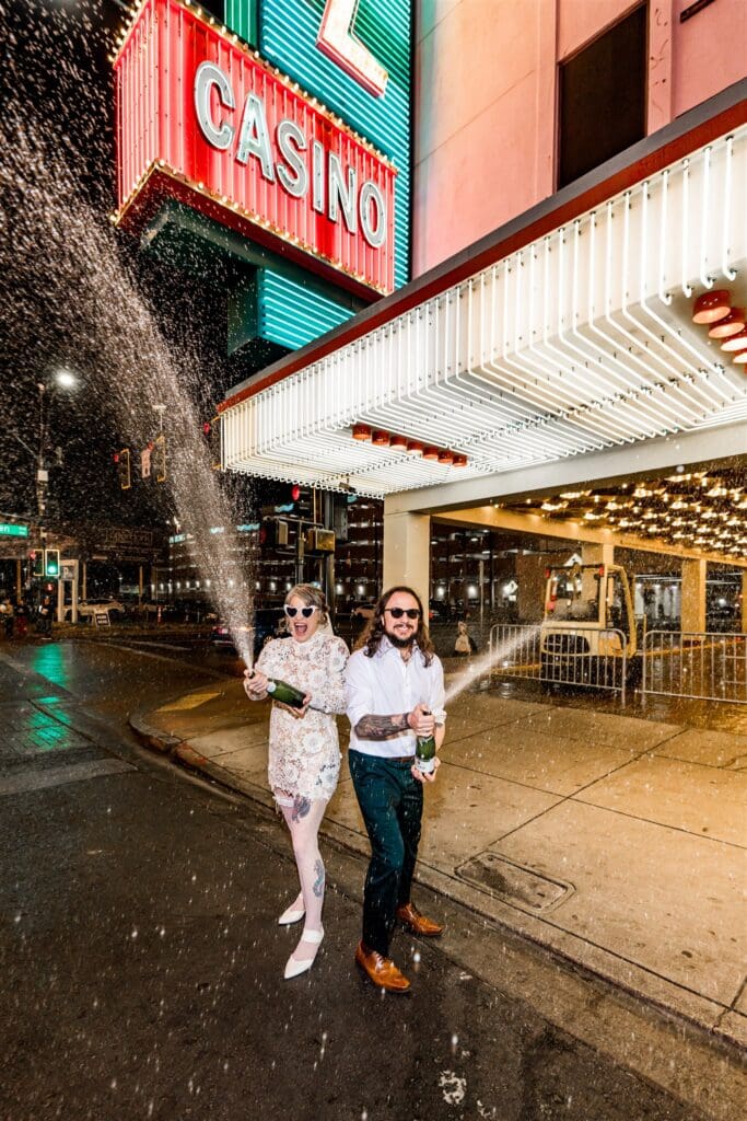 Couple celebrating their elopement with champagne