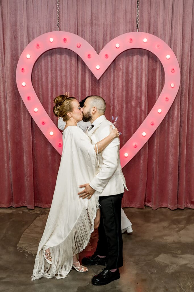 cute picture of the bride and groom kissing