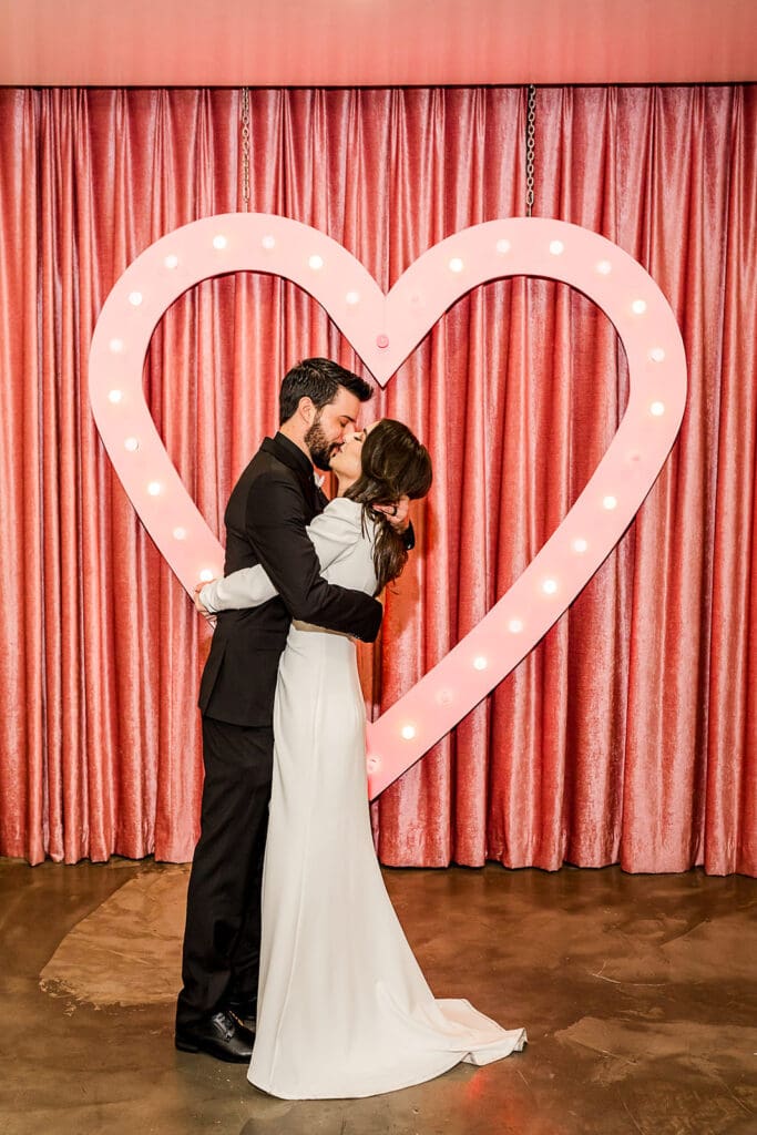 newlyweds kissing after their ceremony