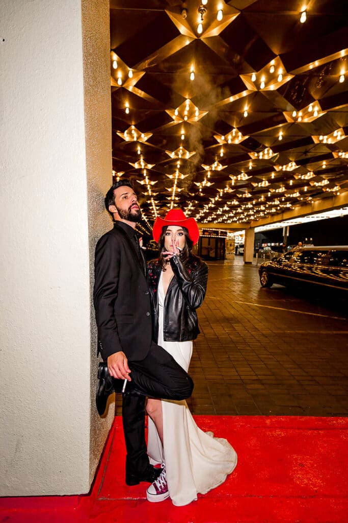 couple walking around downtown fremont street after their ceremony